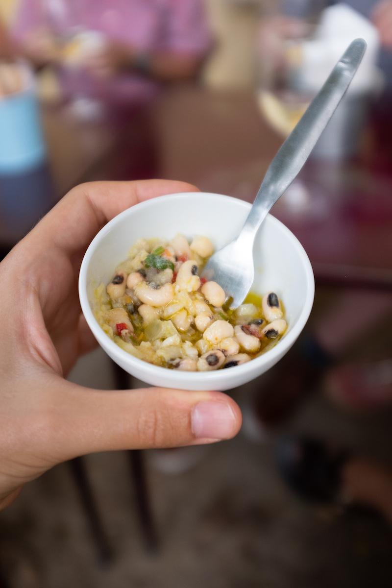 a close up of a person holding a bowl of food