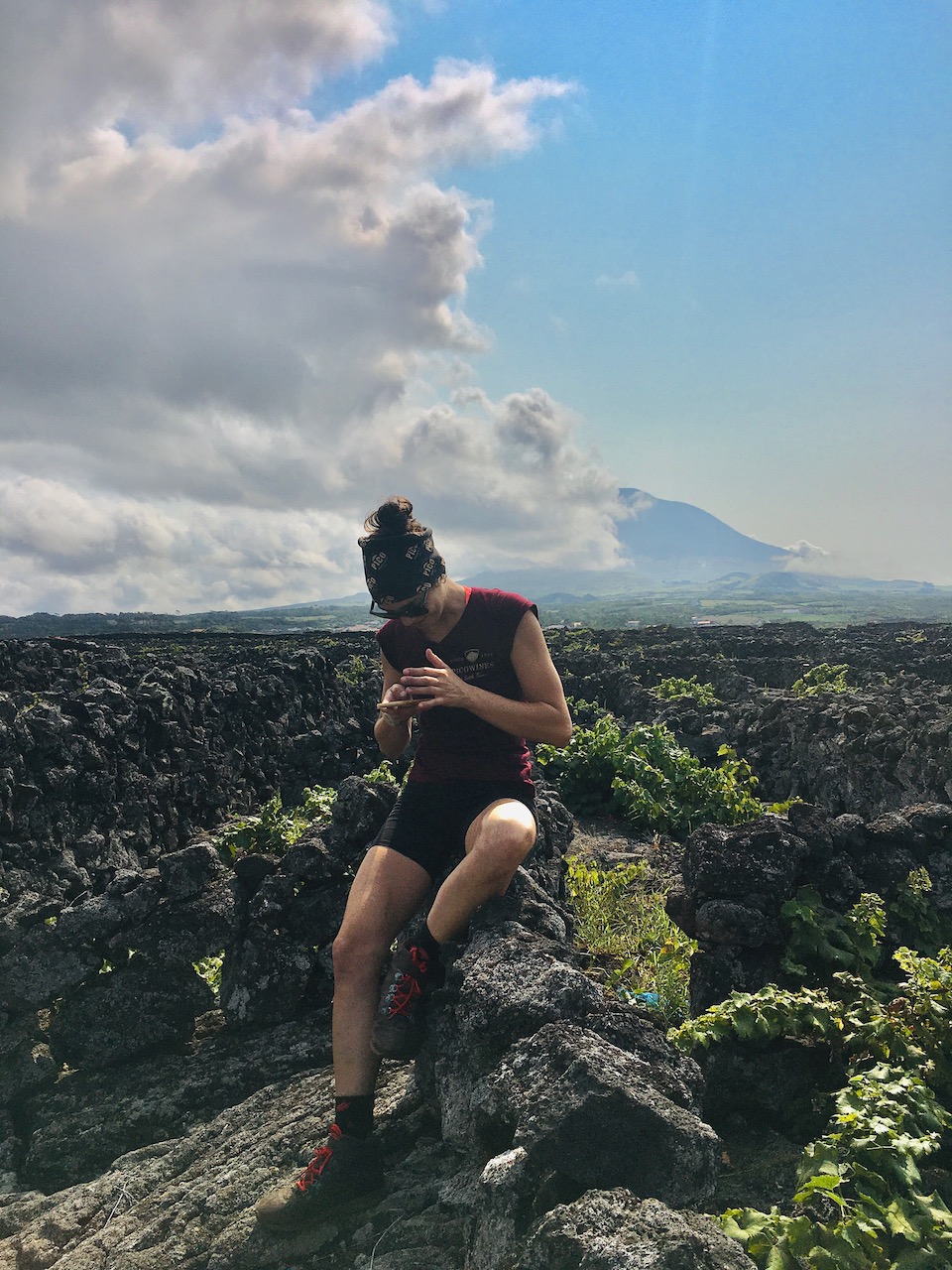 a person standing on a rocky hill