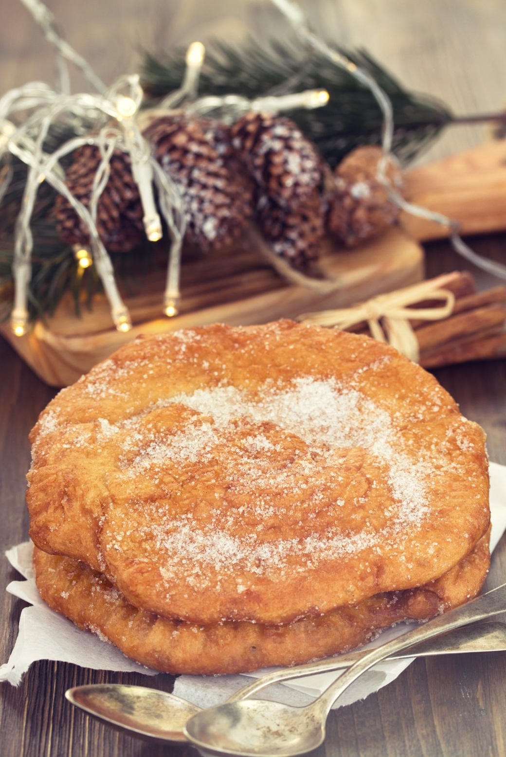 a close up of a Portuguese sweet dough sitting on top of a plate