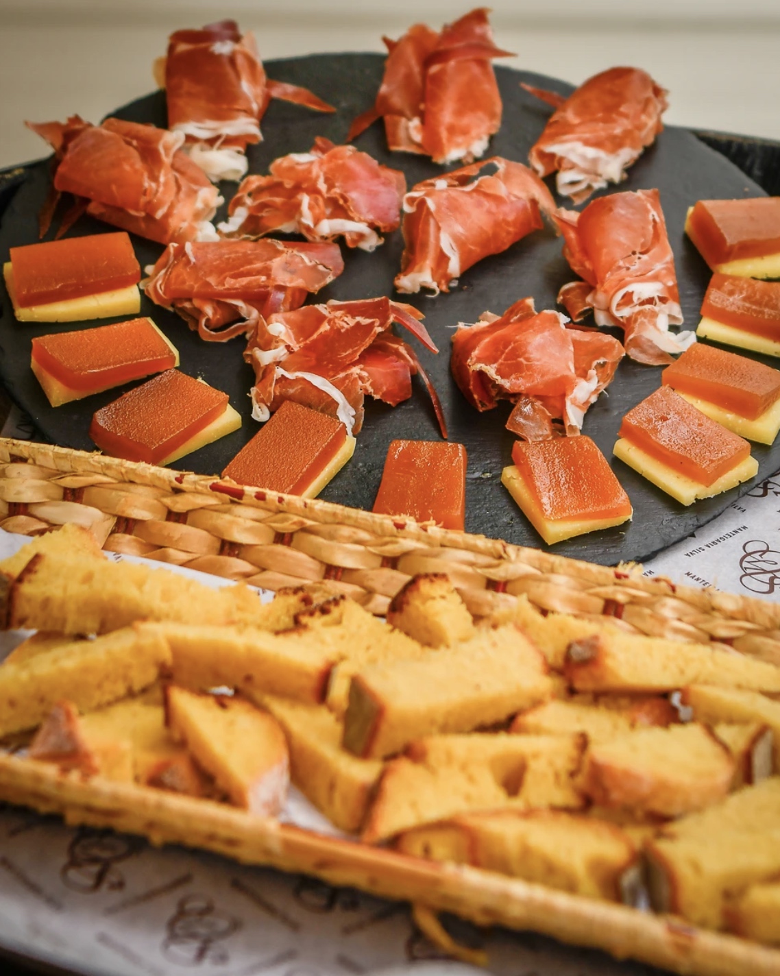 a tray of ham, cheese and bread