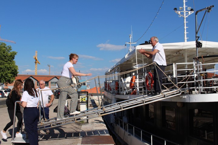 a group of people standing on a dock