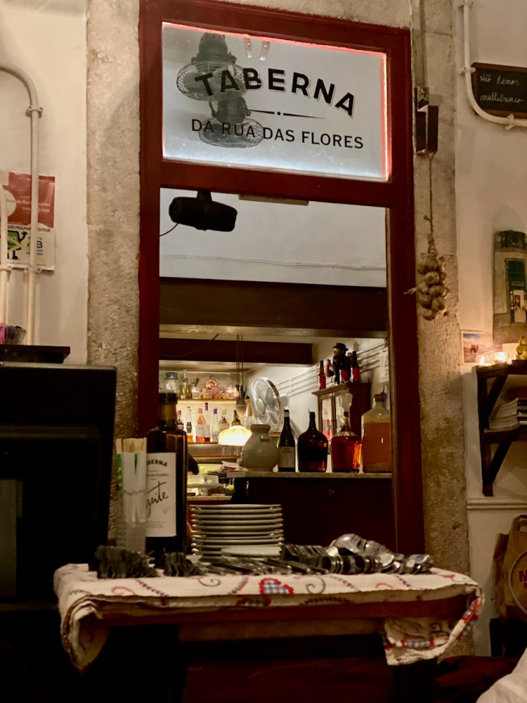 a table that has a sign on a wall